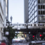 photo of Chicago street showing a El Train